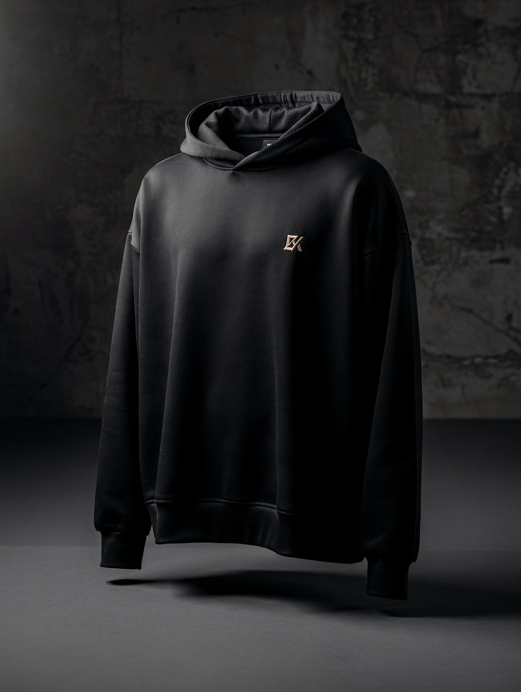 Streetwear hoodie with minimalist graphic design in a dark studio setting